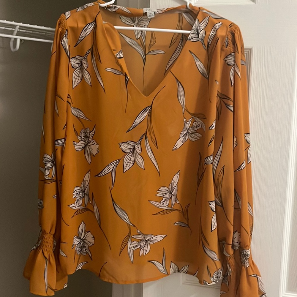 Orange shirt with flower designs